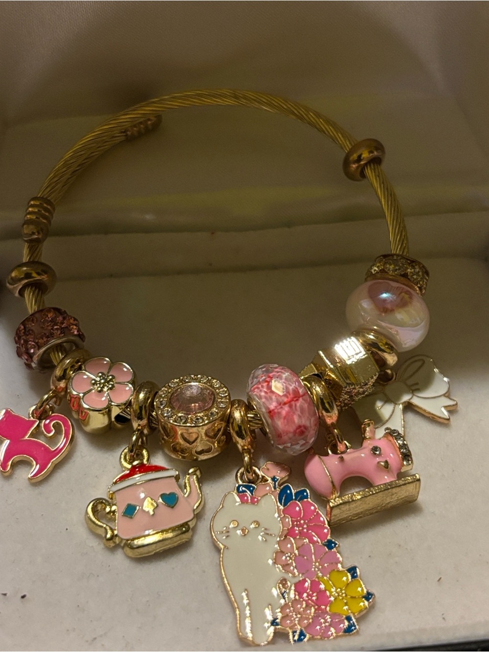 Gold-Tone Pink Charm Bracelet with Floral Cat Pendant